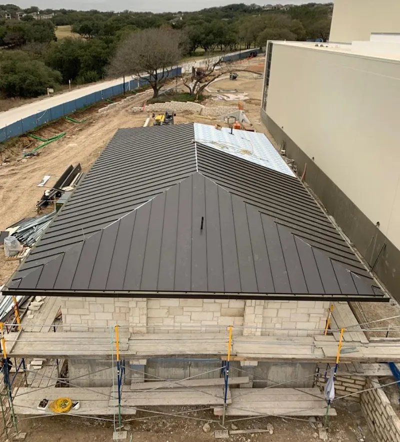Metal roof new construction with scaffolding in Greenville